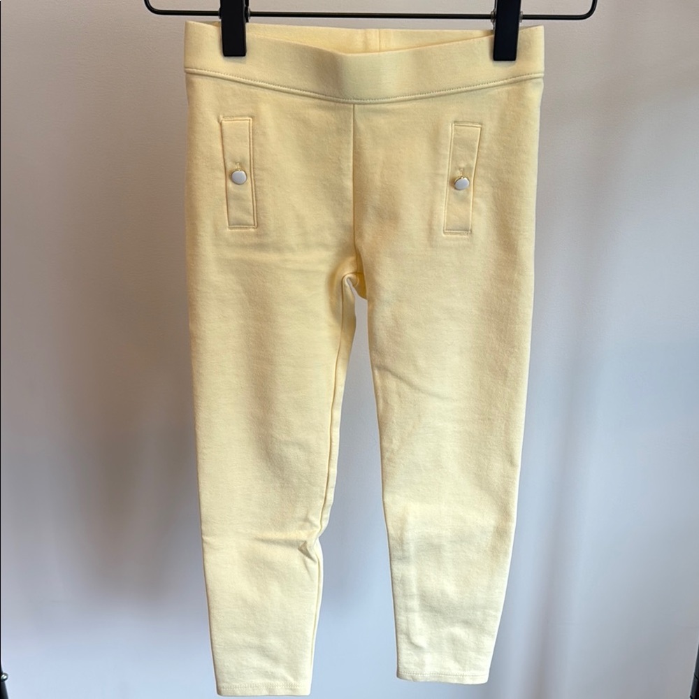 Janie and Jack girls size 5 pale yellow leggings with white button detail